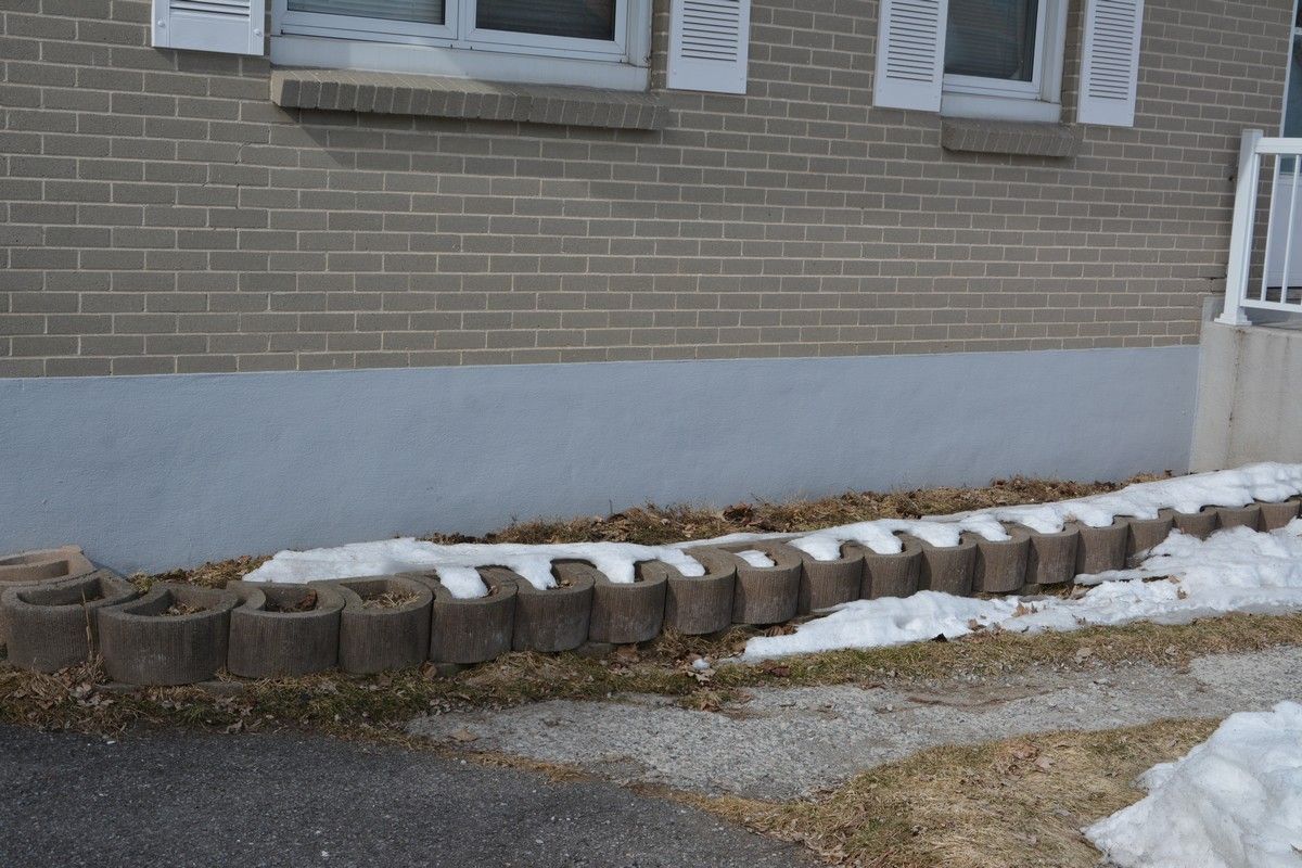 Parging Ottawa, fresh mortar coat applied to foundation wall
