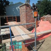 Bridging-scaffold-to-the-protected-roof-for-chimney-take-down